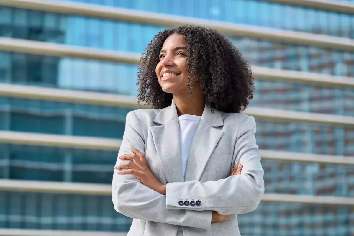 person standing with arms crossed person standing with arms crossed
