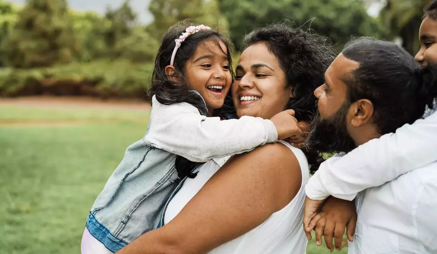 person holding child person holding child