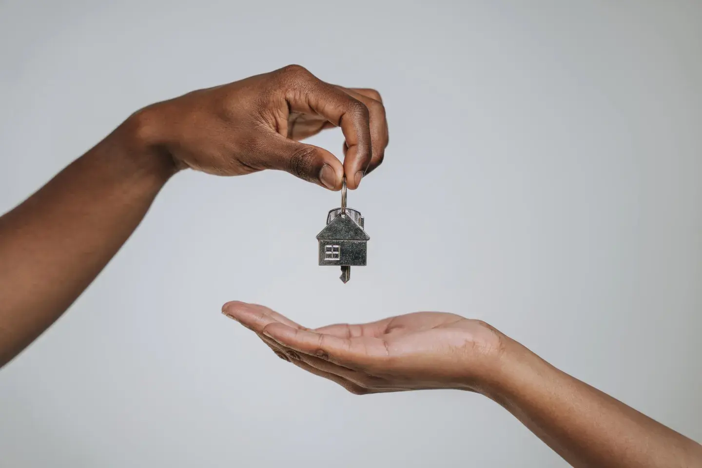 hands holding keys