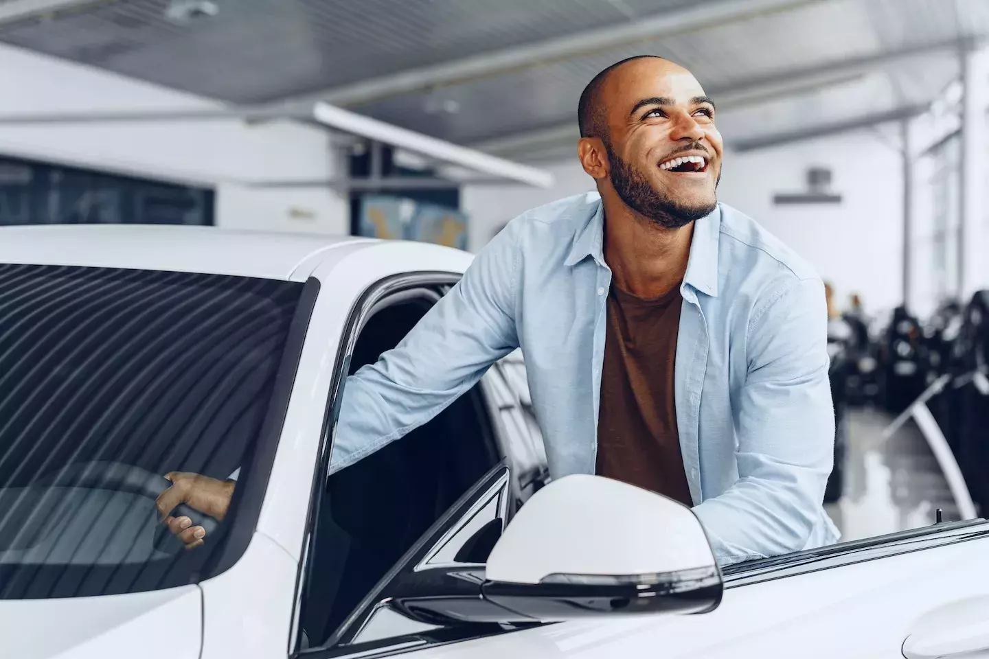 person getting into car person getting into car