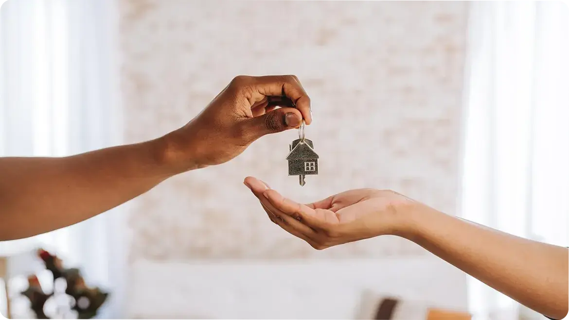 Two hands with house keys
